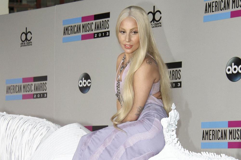 Lady Gaga arriving at the AMAs on a white horse 