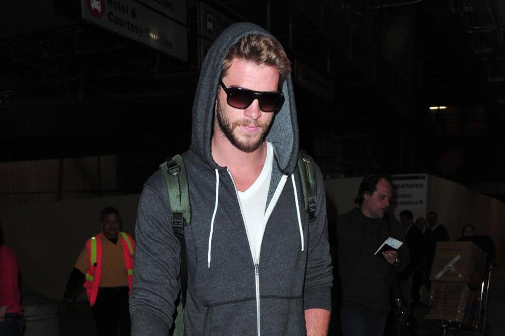 Liam Hemsworth arriving at LAX