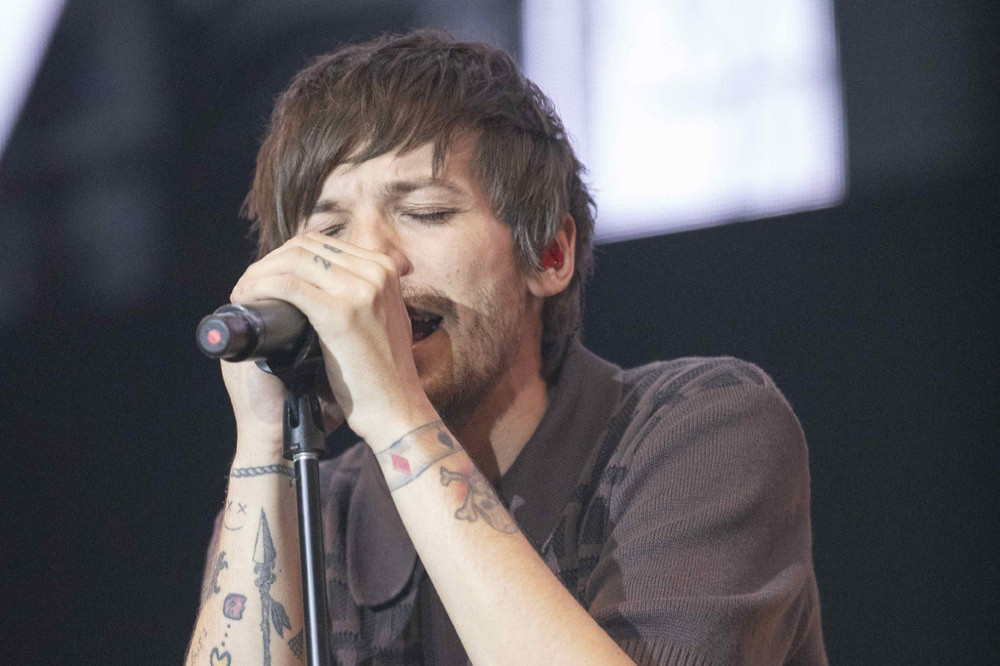 Louis Tomlinson registers four new solo songs