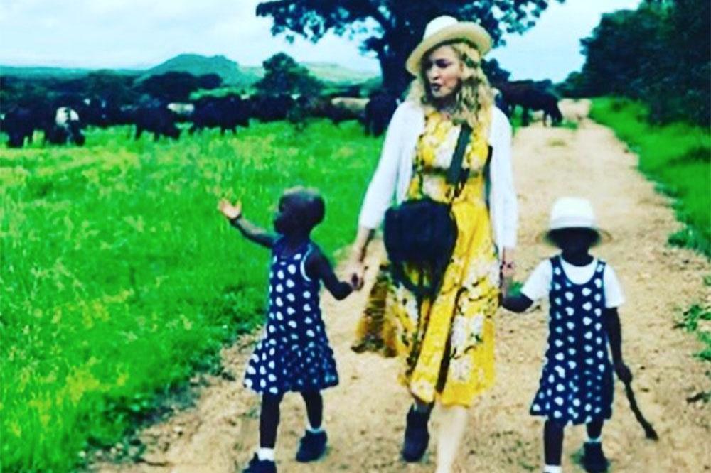 Madonna and her twin daughters, Stella and Esther