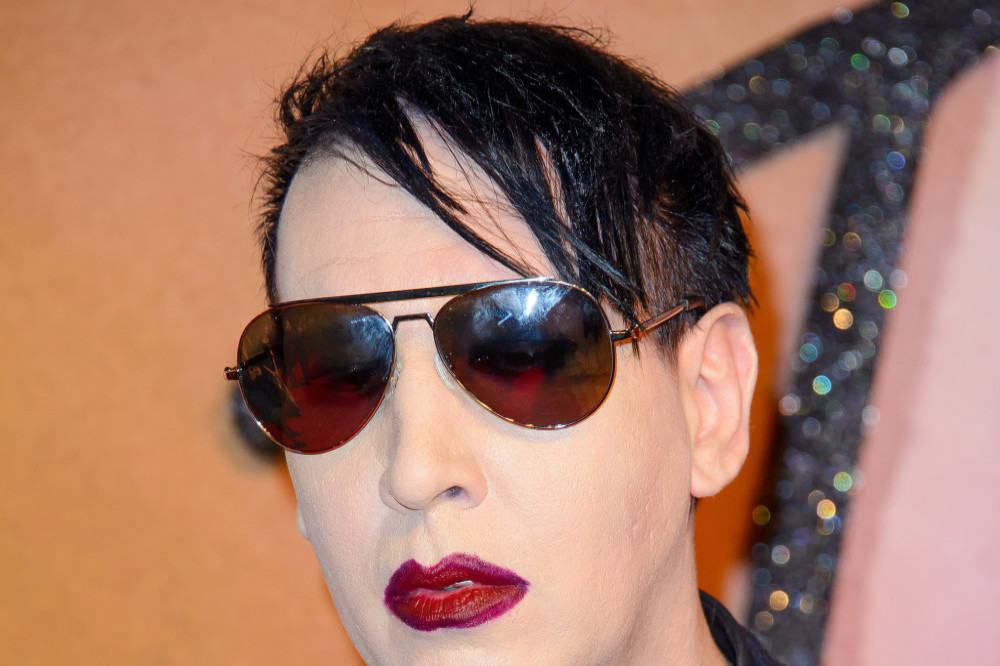 Marilyn Manson is locked in a lawsuit with former fiancee Evan Rachel Wood