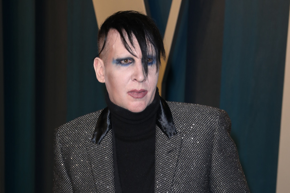 Marilyn Manson has settled a lawsuit filed by a woman who accused him of rape