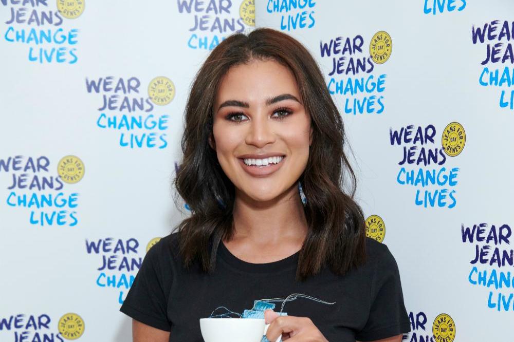 Montana Brown wearing the Jeans for Genes Day T-shirt