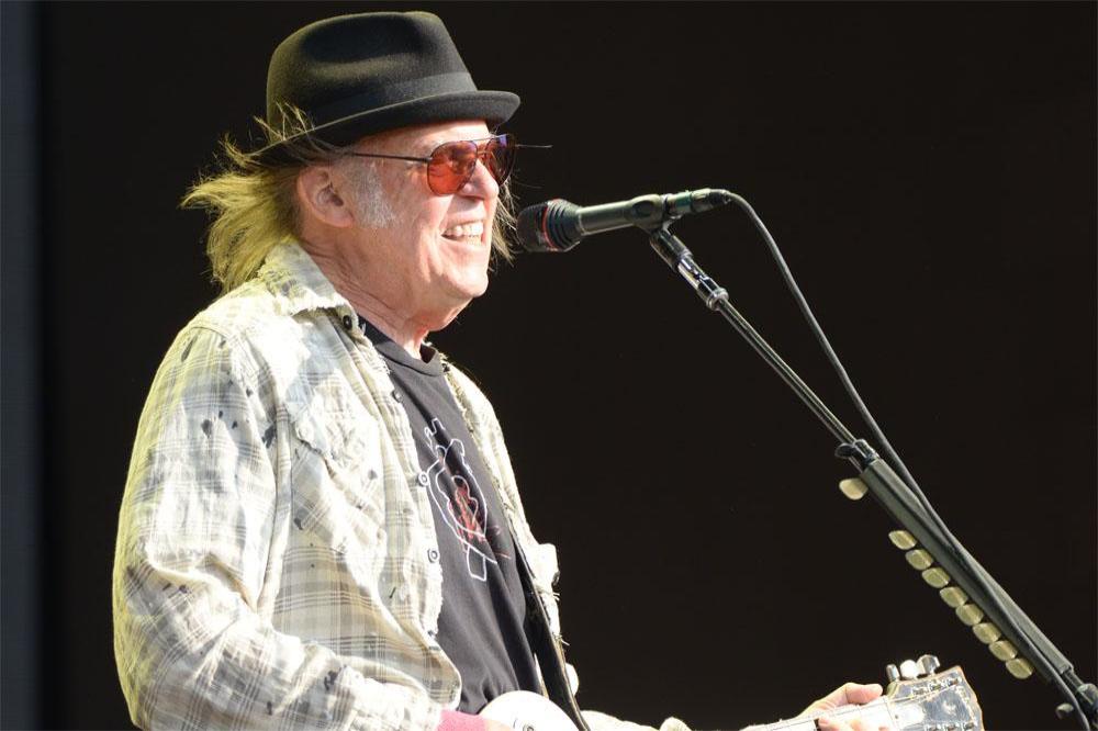 Neil Young performing in Hyde Park