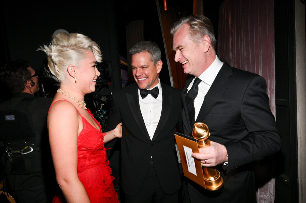Oppenheimer's Christopher Nolan celebrates with stars Matt Damon and Florence Pugh