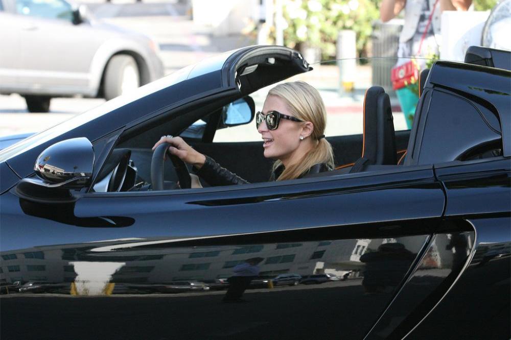 Paris Hilton leaving dealership in car