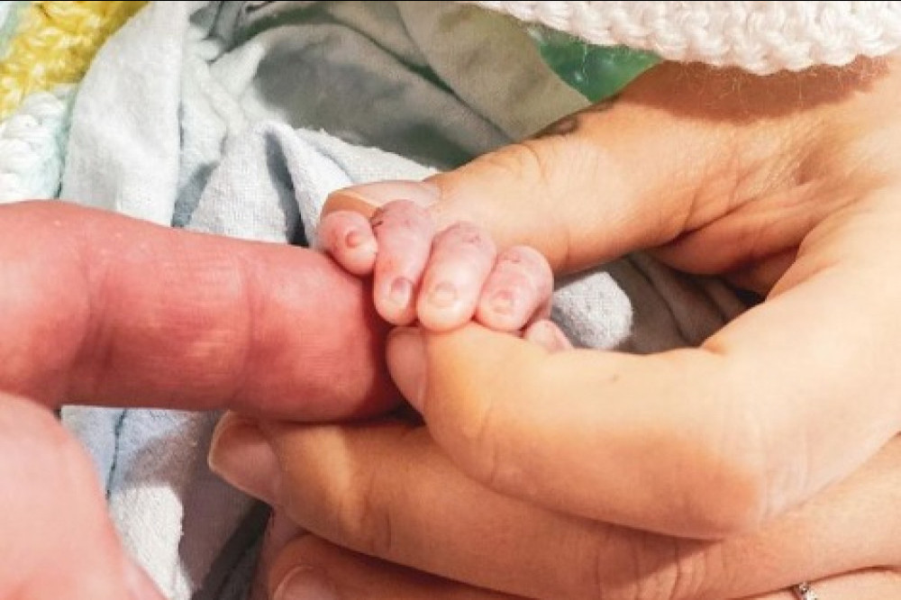 Paul Costabile, Christina Perri and daughter's hands (c) Instagram