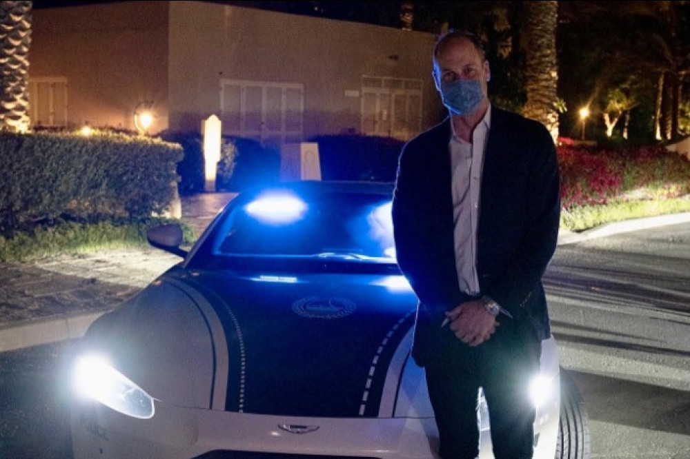 Prince William poses with police car in Dubai