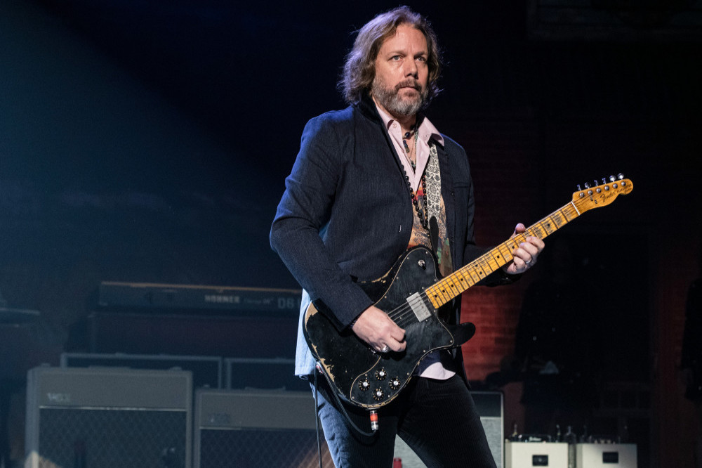 Rich Robinson used his guitar to put the invader back into the audience