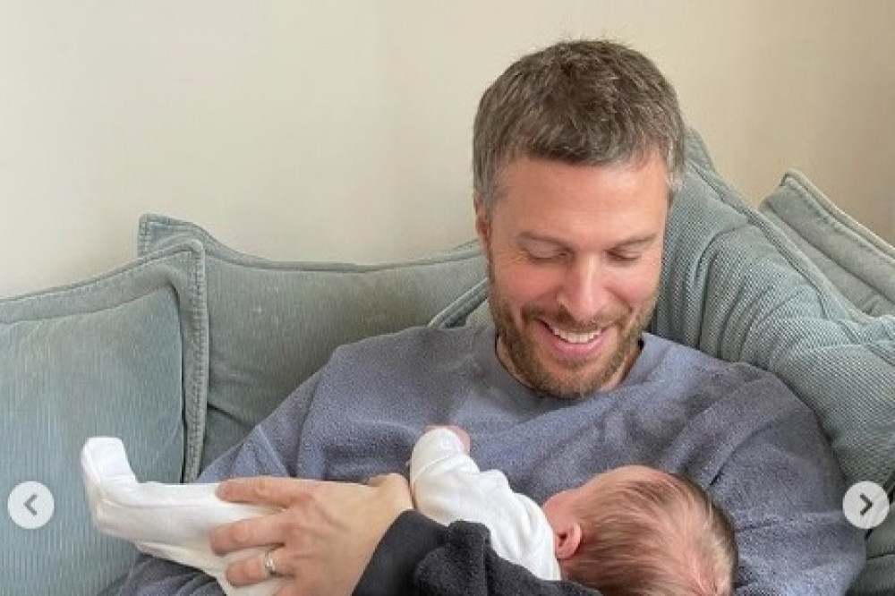 Rick Edwards enjoying a cuddle with his newborn son (c) Instagram