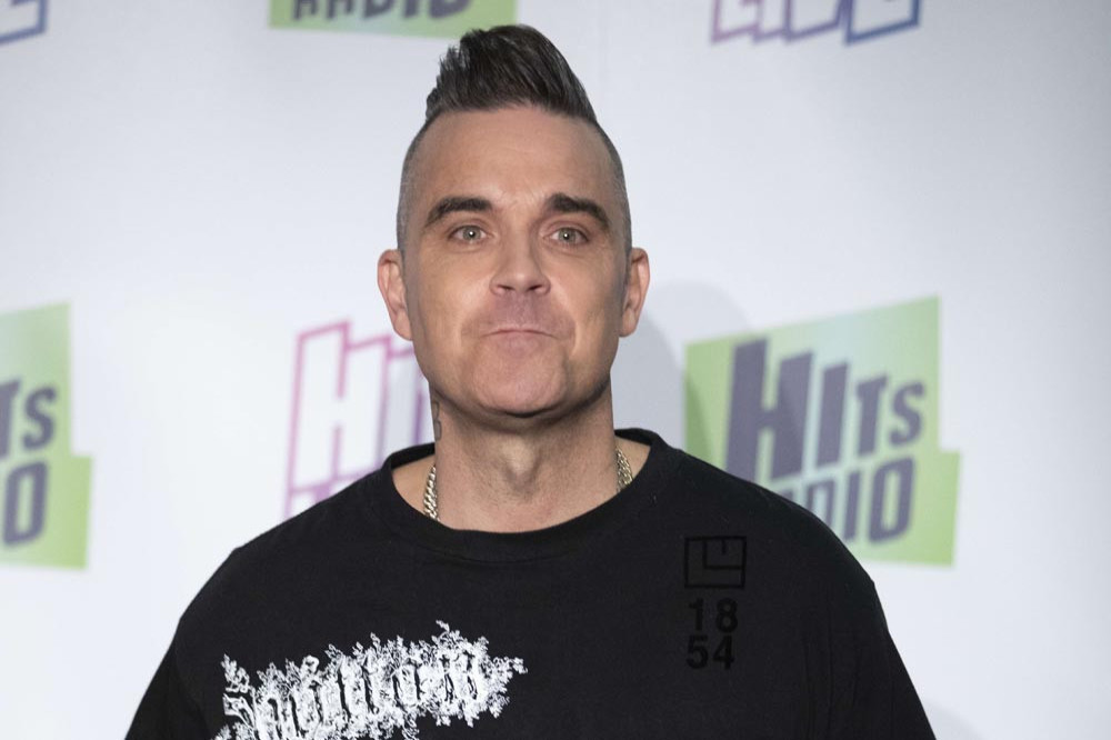 Robbie Williams is curating an art exhibition with Ed Godrich