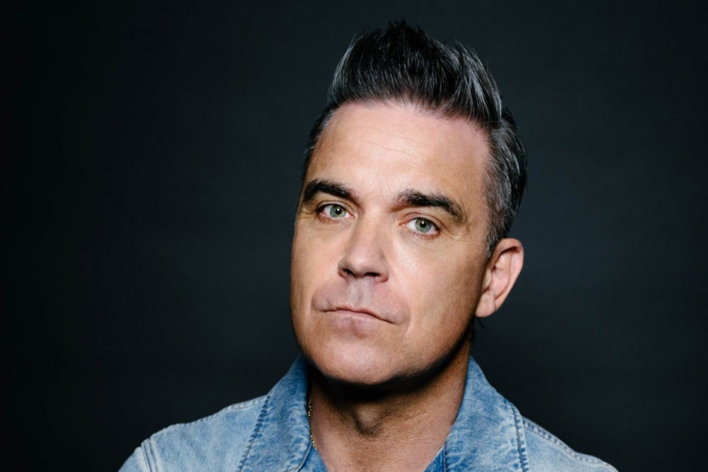 Robbie Williams slashed his wrists as he struggled to cope with fame