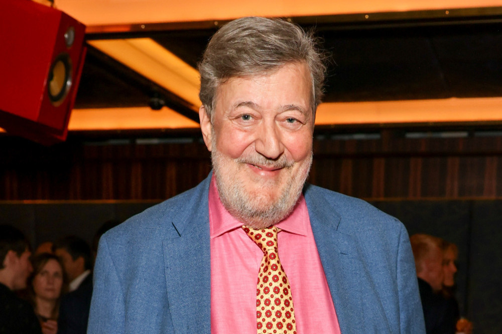 Stephen Fry was rushed to hospital with rib and leg injuries after he plunged from a 6ft-high stage during a talk on AI