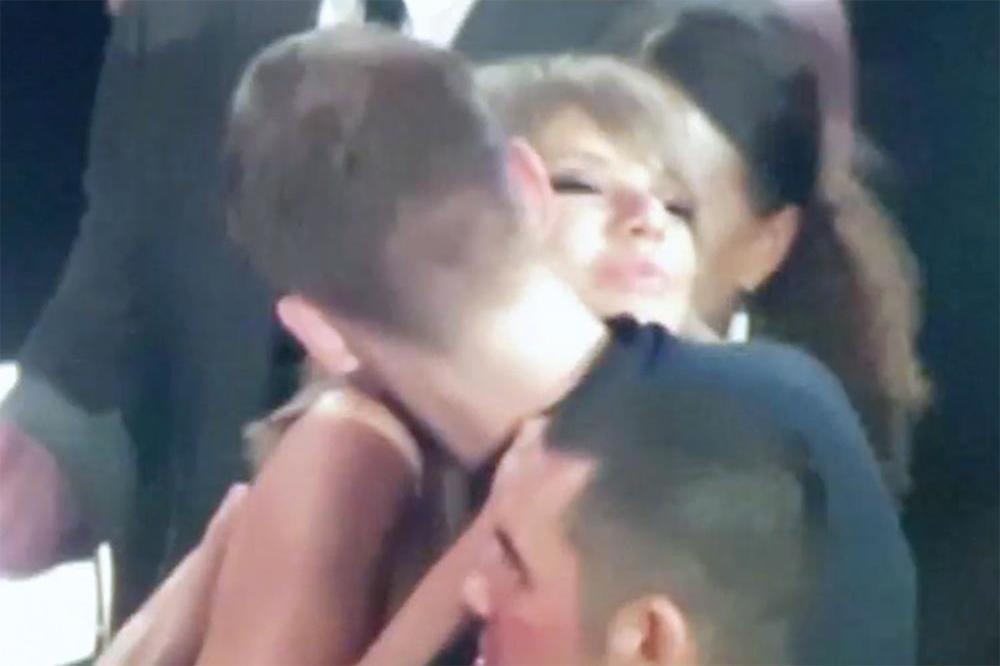 Taylor and Calvin embracing at the Billboard Music Awards