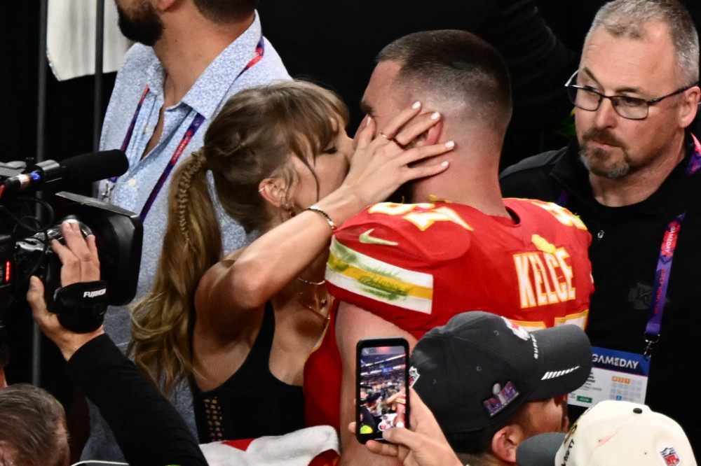 Taylor Swift kisses Travis Kelce after the Super Bowl