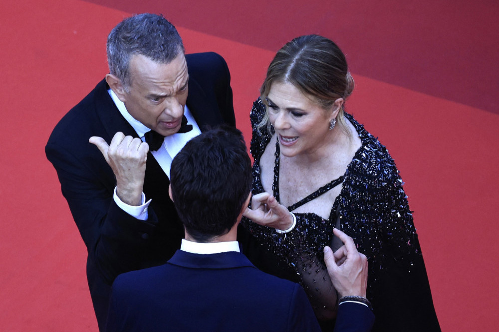 Tom Hanks’ wife has dismissed reports she and the actor had a row with a PR manager on a Cannes Film Festival red carpet