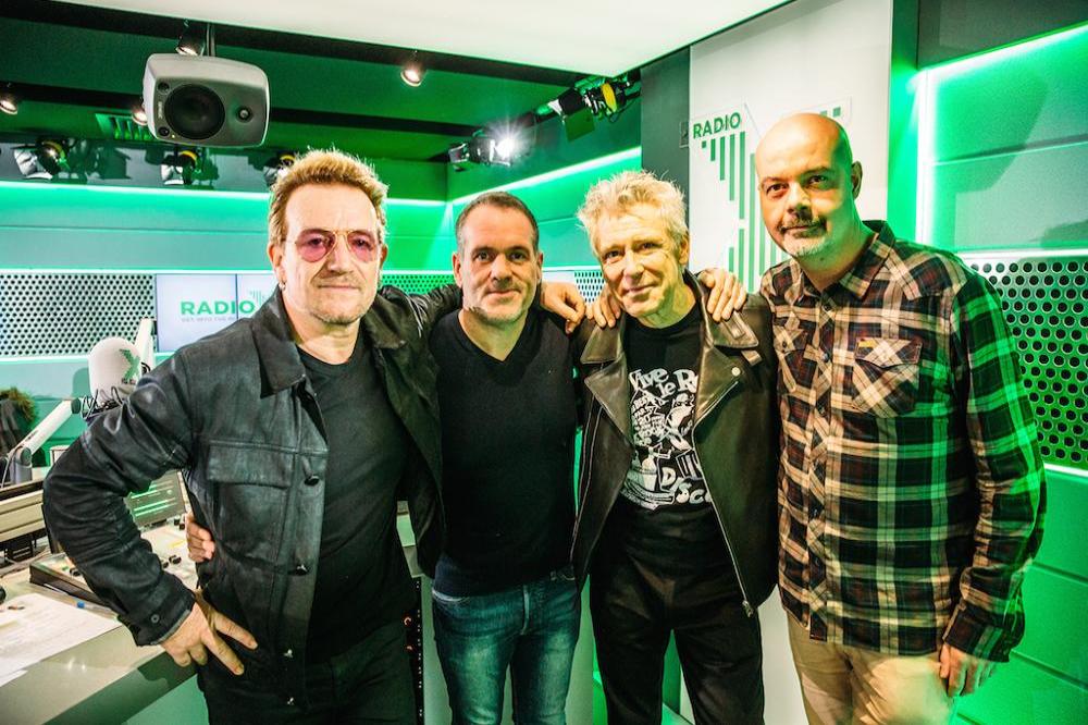 U2's Bono and Adam Clayton with Chris Moyles at Radio X studios