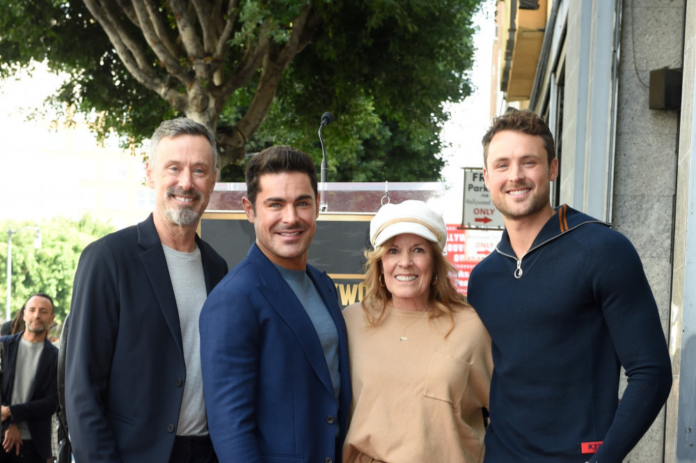 Zac Efron (second left) has thanked his mom Starla and dad David for their constant  support