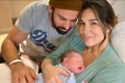 Jessie James Decker and her husband Eric cuddle their baby son Denver