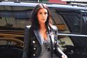 Kim Kardashian flaunts her legs in grey jeans