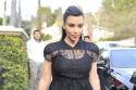 Kim Kardashian stepped out in a simple black lace skater dress