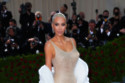 Kim Kardashian wearing Marilyn Monroe's famous dress