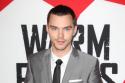 Nicholas Hoult looked dapper in a grey suit