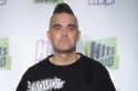 Robbie Williams has opened up on his first time