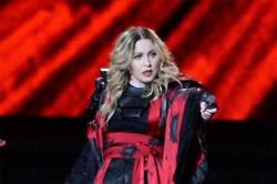 Madonna Exposes Fan's Breast During Gig
