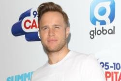 Louis Walsh questions Olly Murs' singing