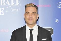 Robbie Williams is moving back to England