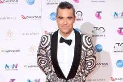 Robbie Williams records for Grenfell Tower charity single