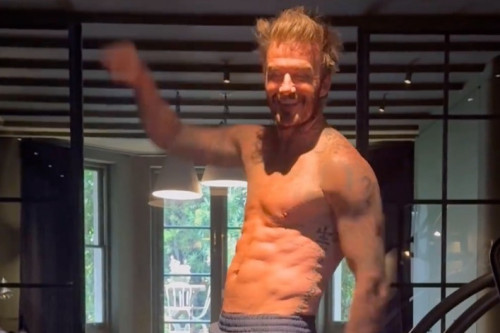 David Beckham’s wife Victoria marked his 49th birthday by posting a video of him flaunting his six-pack during a workout