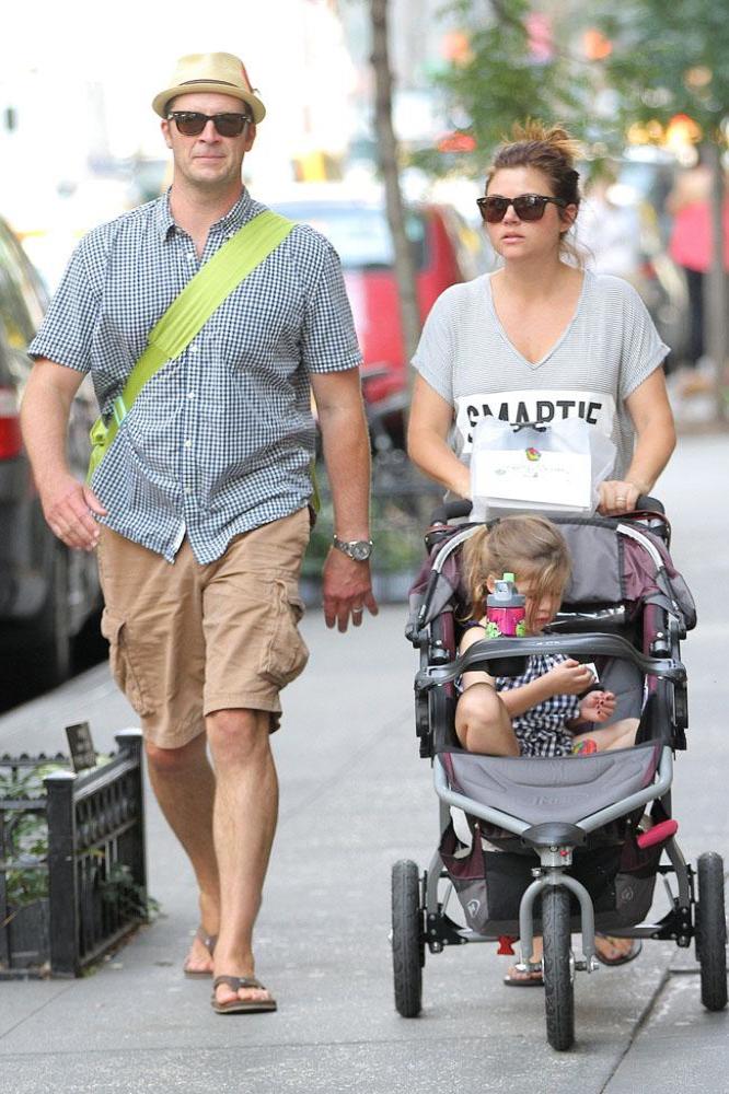 Tiffani Thiessen with husband Brady Smith and daughter Harper