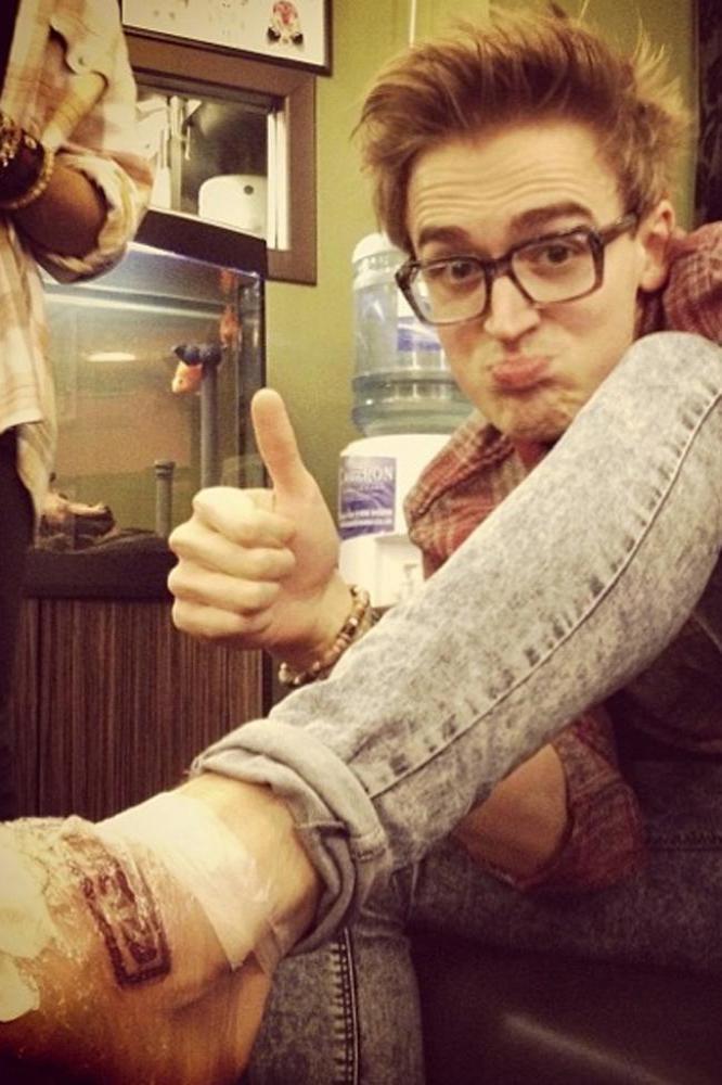 Tom Fletcher showing off his new tattoo