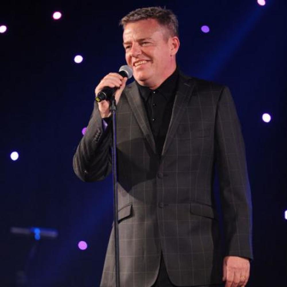 Suggs on stage at An Evening with Suggs