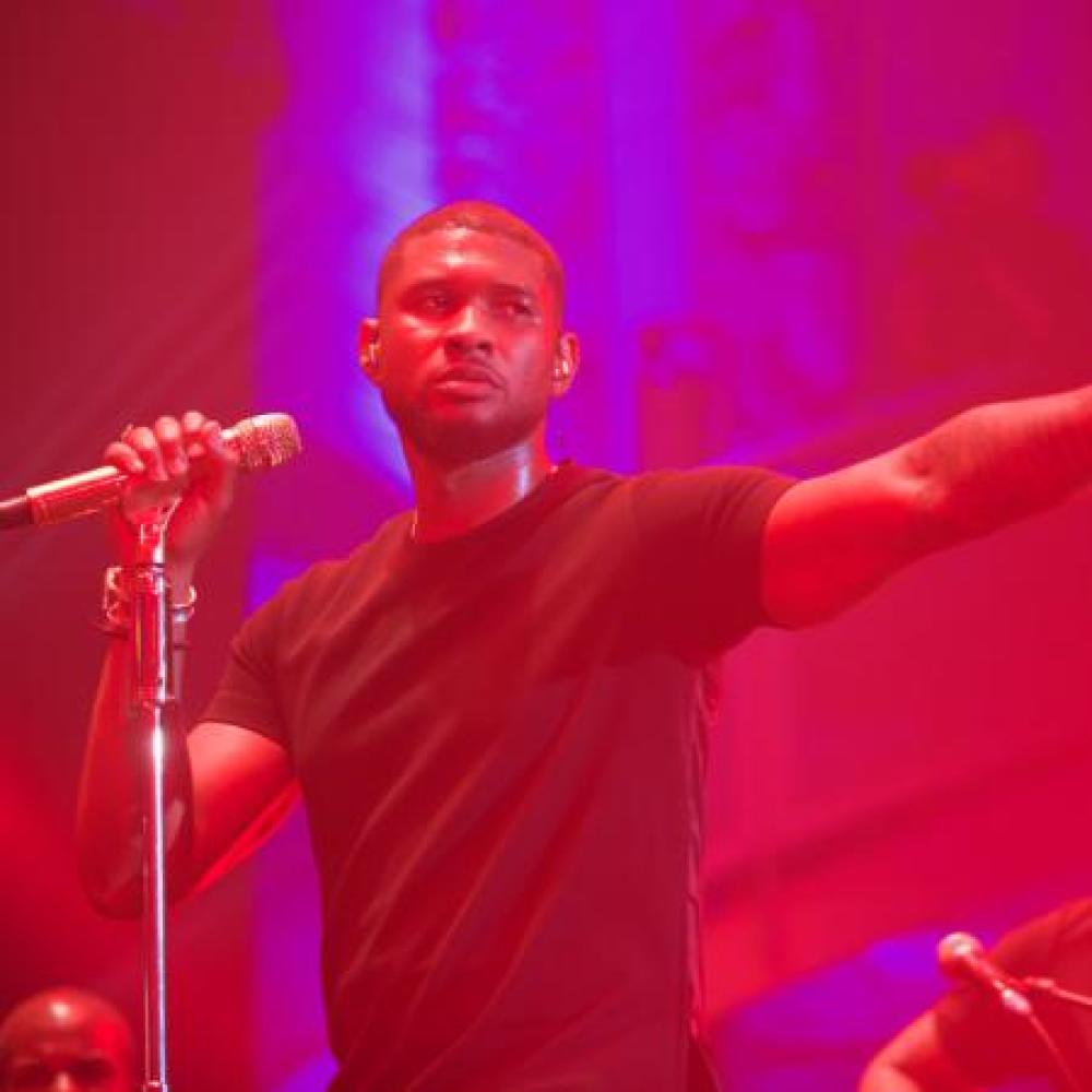 Usher performing for MasterCard