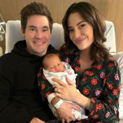 Adam Devine and Chloe Bridges have welcomed a baby boy