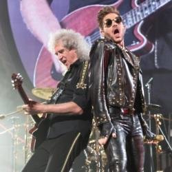 Adam Lambert and Brian May on stage