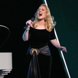 Adele was forced to take a seat due to the agony of her sciatica