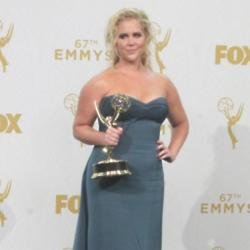 Amy Schumer showing off her Emmy award