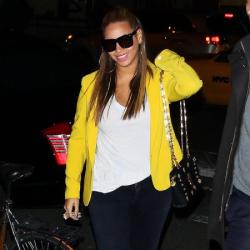Beyonce Knowles wearing a bright blazer