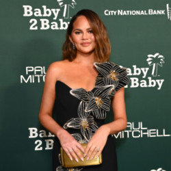Chrissy Teigen shrugged off an embarrassing wardrobe malfunction that left her exposed