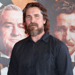 Christian Bale says he was a “mediator” on the tense set of ‘American Hustle’
