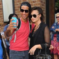 Demi Lovato with a fan