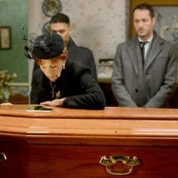 Dot grieves over Nick's coffin