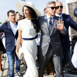 George Clooney has praised his wife Amal for her work as a human rights lawyer