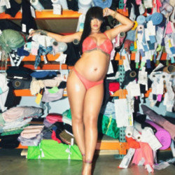 Heavily pregnant Rihanna has showed off her huge baby bump in another steamy snap as she waits for the new arrival