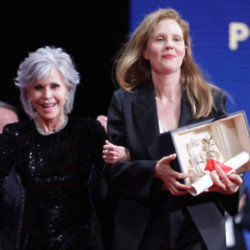 Jane Fonda cheekily chucked an award at director Justine Triet’s back during the 2023 Cannes Film Festival