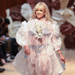 Jo Wood dressed in a sheer gown with her under garments on display